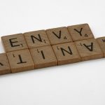 scrabble, scrabble pieces, lettering, letters, wood, scrabble tiles, white background, words, quote, letters, type, typography, design, layout, focus, bokeh, blur, photography, images, image, envy, vanity, two sides of the same coin,